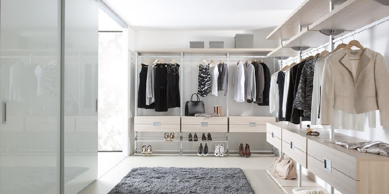 cream and white walk in wardrobe